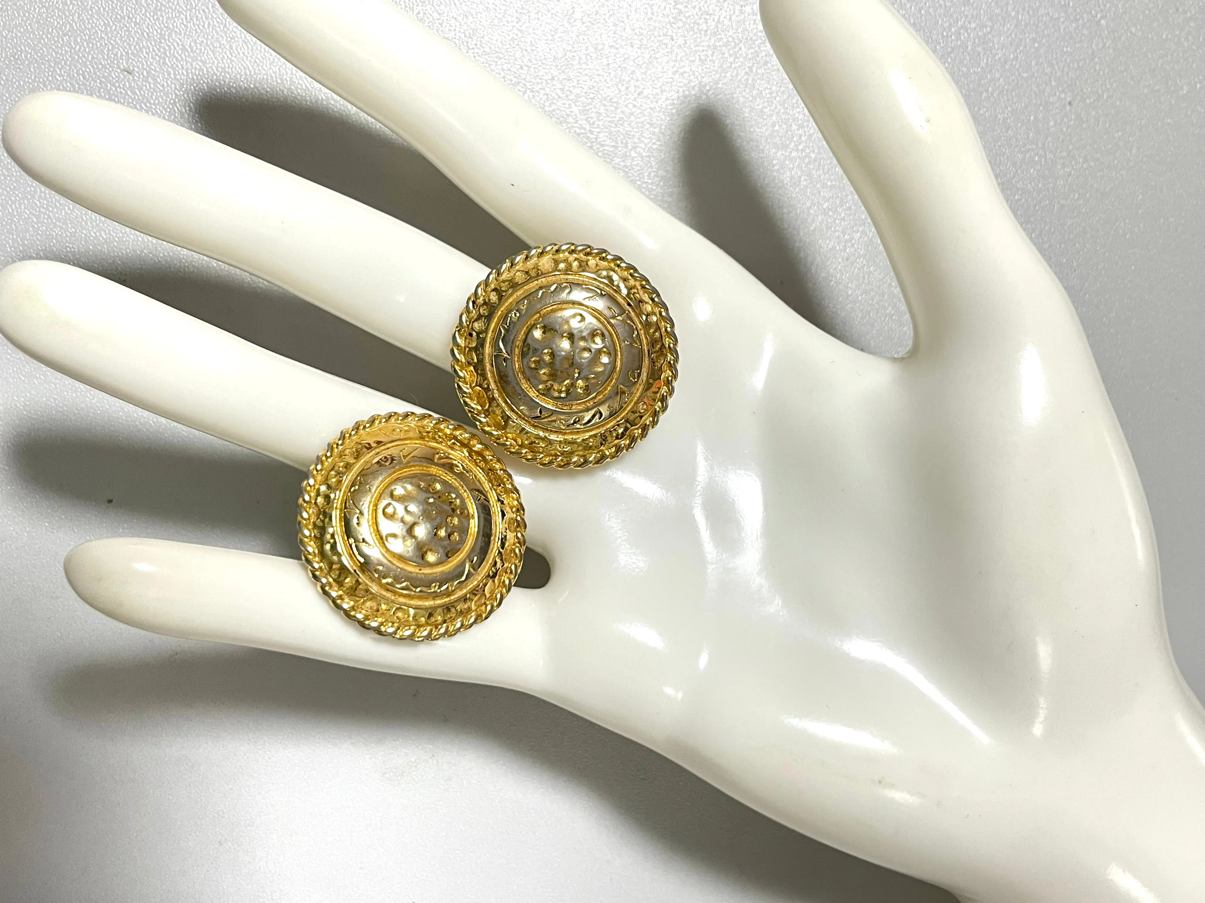 Vintage Yves Saint Laurent golden round logo earring with engraved signature. 0410132