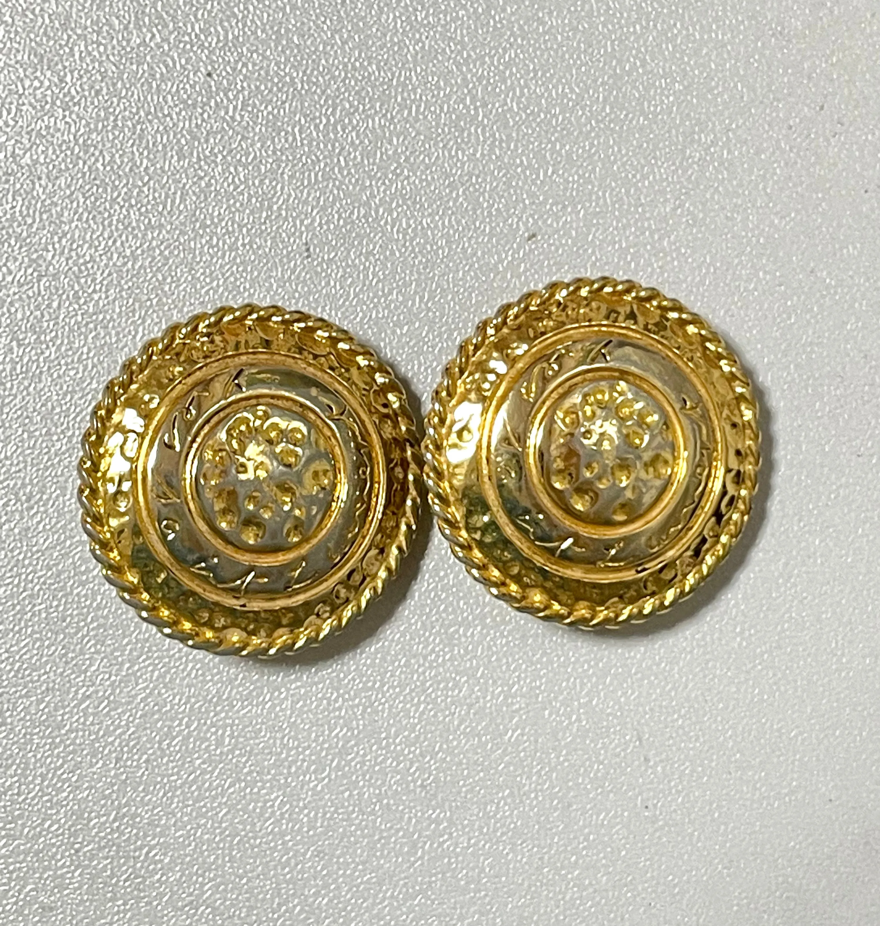 Vintage Yves Saint Laurent golden round logo earring with engraved signature. 0410132